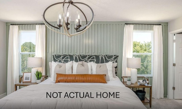 carpeted bedroom with an inviting chandelier and multiple windows