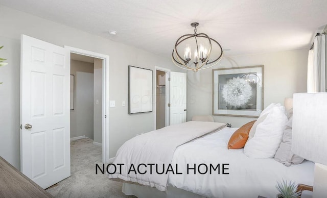 carpeted bedroom with a notable chandelier