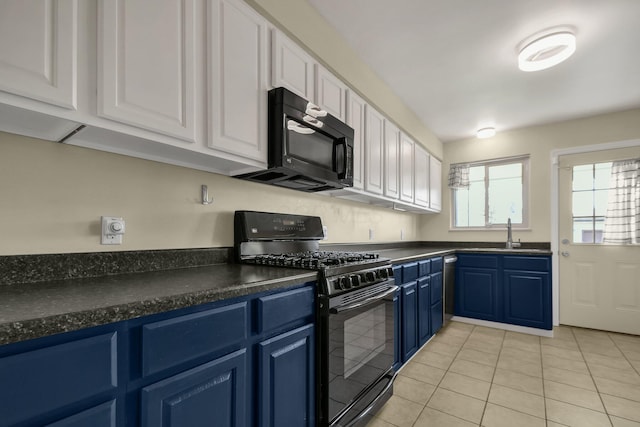 kitchen with blue cabinetry, sink, light tile patterned floors, white cabinets, and black appliances