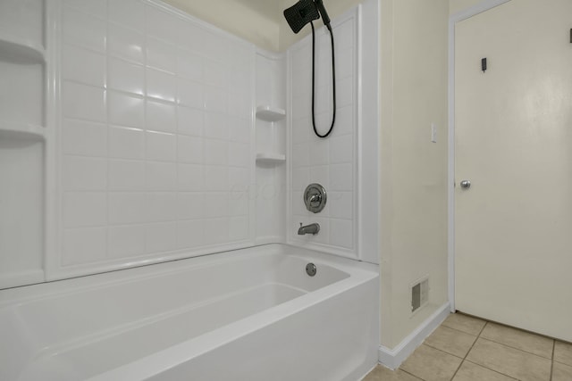 bathroom with tile patterned floors and shower / tub combination