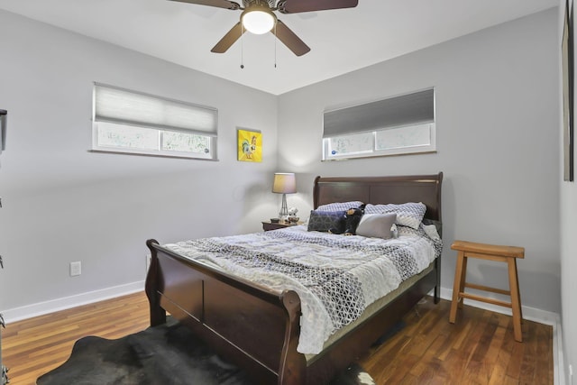 bedroom featuring ceiling fan and dark hardwood / wood-style flooring