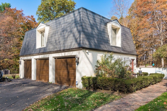 view of home's exterior with a garage