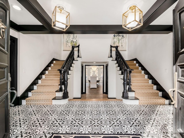 foyer with beamed ceiling