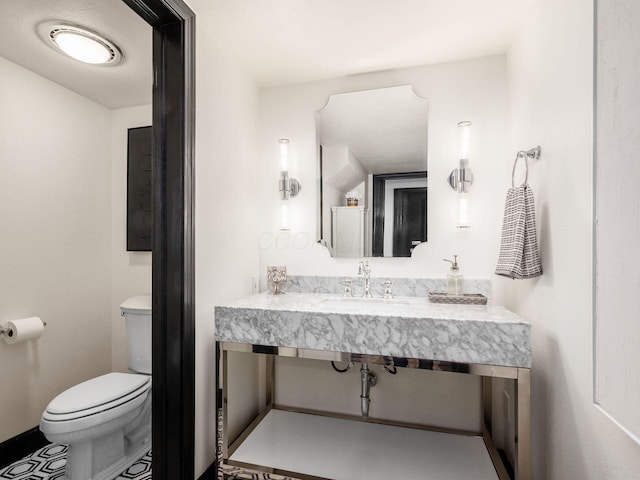 bathroom with toilet and sink