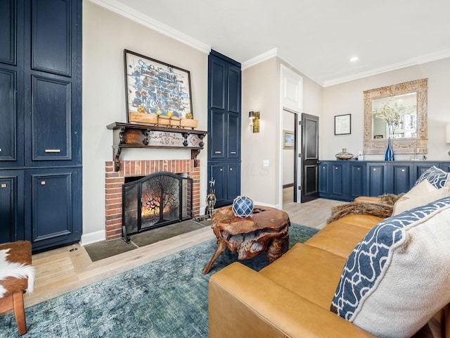 living room with a fireplace, light hardwood / wood-style floors, and crown molding