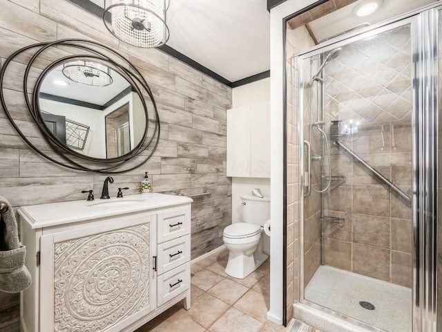 bathroom featuring tile patterned floors, vanity, toilet, and walk in shower