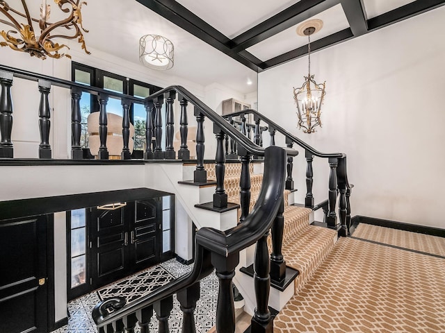 entrance foyer featuring beamed ceiling, coffered ceiling, and a notable chandelier