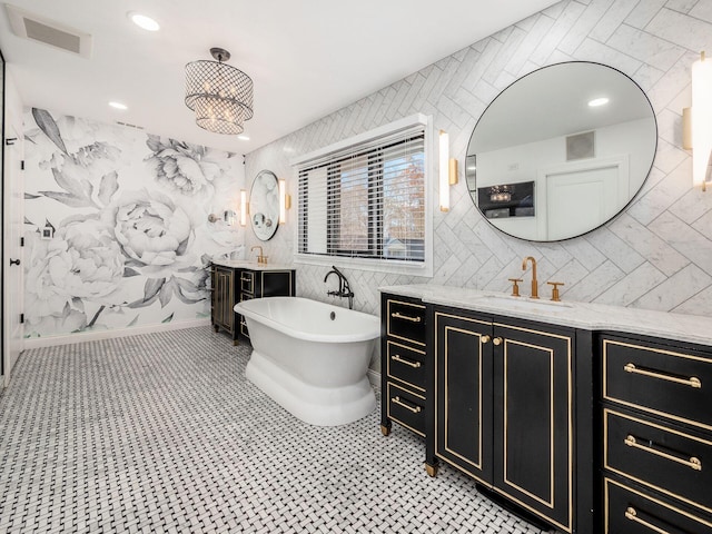 bathroom featuring vanity and a bathing tub