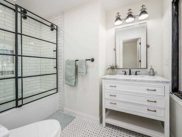 full bathroom featuring tile patterned floors, vanity, enclosed tub / shower combo, and toilet