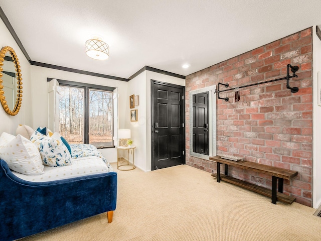 carpeted bedroom with crown molding and brick wall