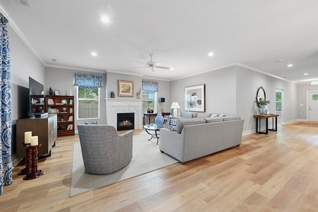 living room featuring light hardwood / wood-style flooring and ornamental molding