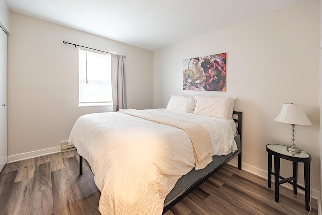 bedroom featuring dark wood-type flooring