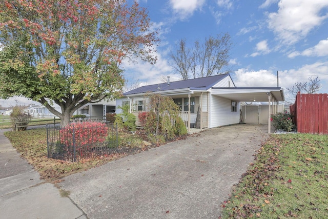 single story home featuring a carport