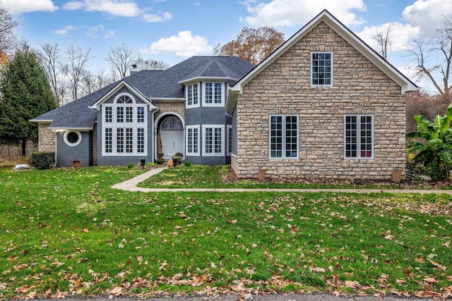 front facade with a front yard