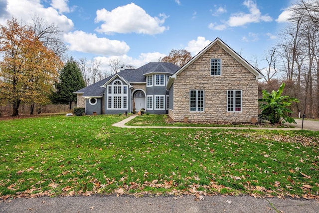 view of property featuring a front lawn