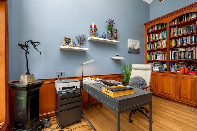 office area with light hardwood / wood-style floors