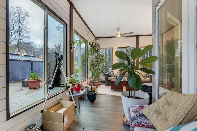 sunroom featuring ceiling fan