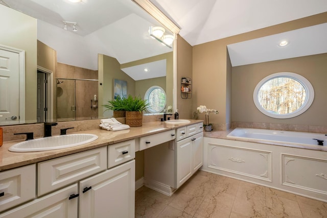 bathroom with vanity, plus walk in shower, and vaulted ceiling