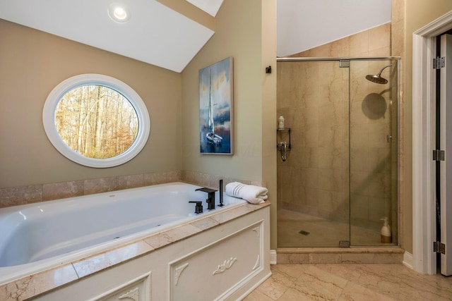 bathroom with separate shower and tub and lofted ceiling