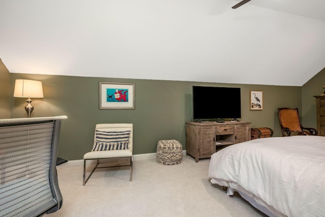 carpeted bedroom featuring ceiling fan and vaulted ceiling