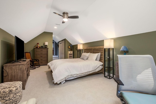 bedroom with ceiling fan, light colored carpet, and lofted ceiling