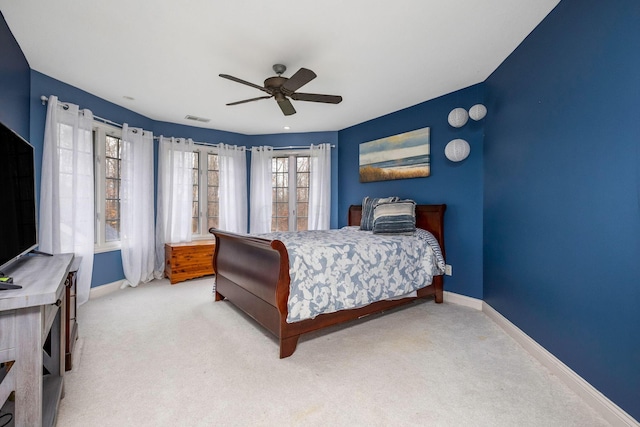 bedroom featuring ceiling fan and light carpet