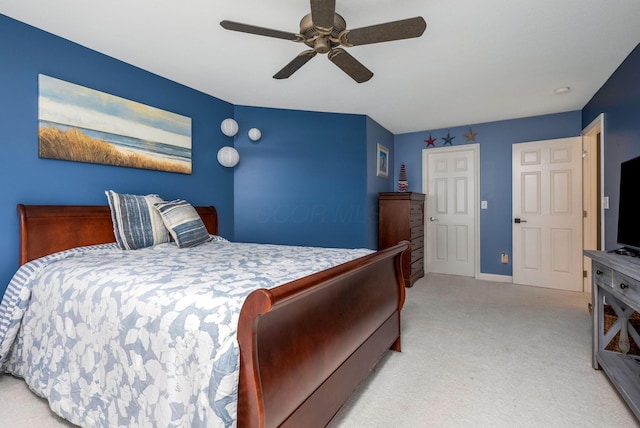 bedroom featuring ceiling fan and light carpet