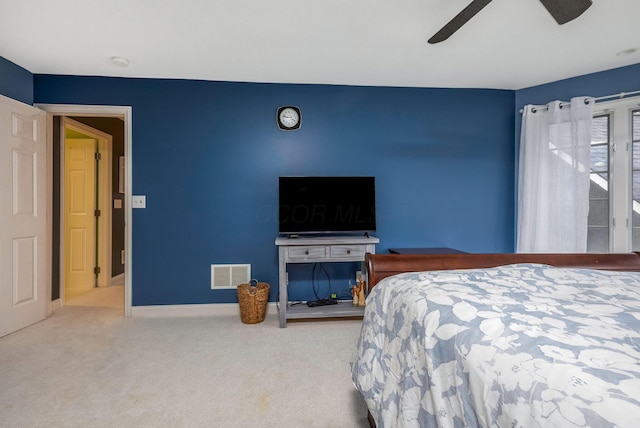 carpeted bedroom featuring ceiling fan