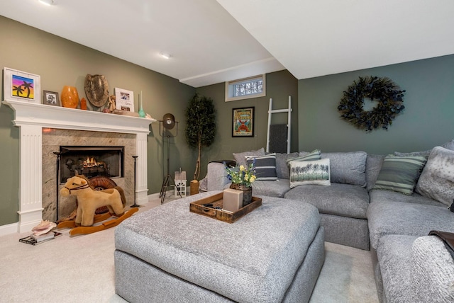 carpeted living room with a tile fireplace