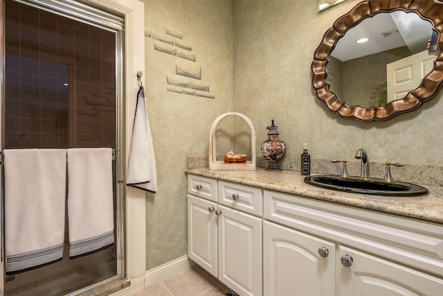 bathroom with tile patterned floors and vanity