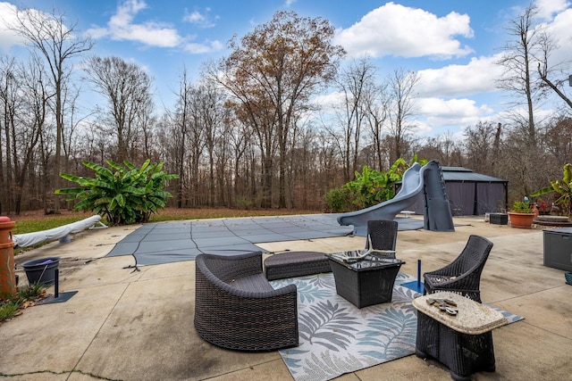 view of patio / terrace with a covered pool