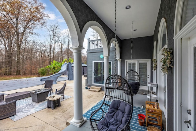 view of patio / terrace with a balcony