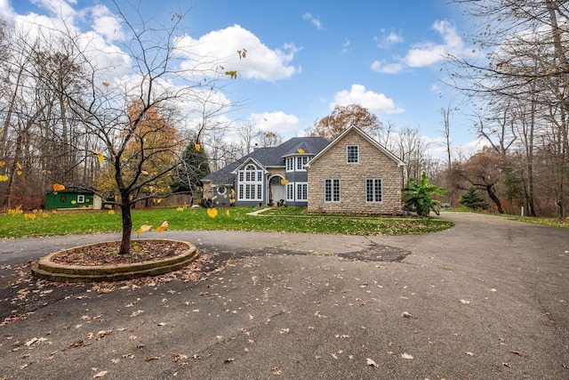 front facade with a front yard