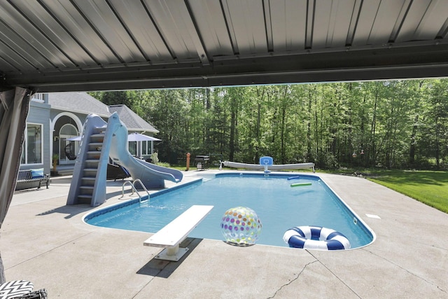 6003 Nichols Ln, Johnstown, OH 43031 - swimming pool featuring a water slide, a patio area, and a diving board