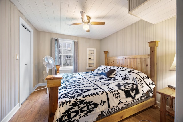 bedroom with ceiling fan and dark wood-type flooring