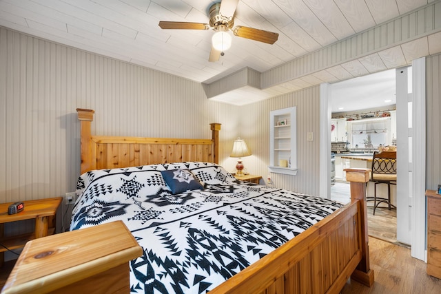 bedroom with light wood-type flooring and ceiling fan