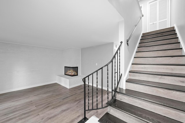 staircase featuring hardwood / wood-style flooring