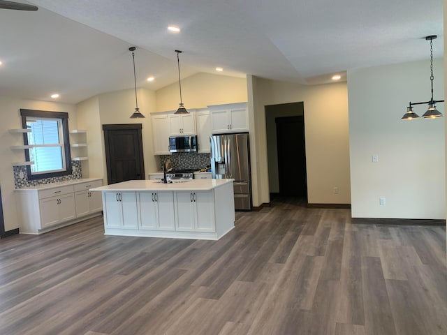 kitchen featuring white cabinetry, dark wood-type flooring, decorative light fixtures, and appliances with stainless steel finishes