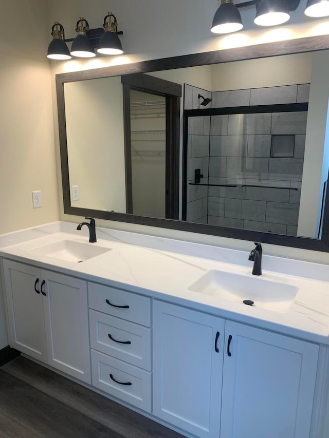 bathroom featuring hardwood / wood-style flooring and vanity