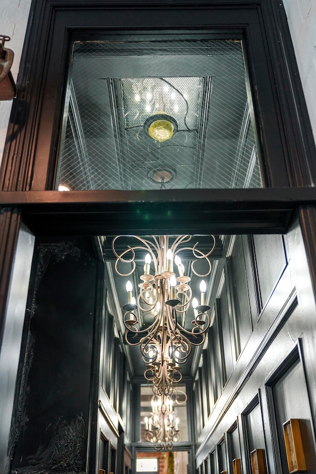 interior details featuring a notable chandelier