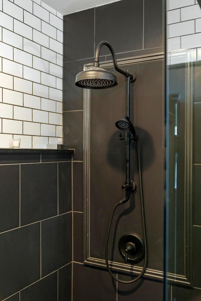 interior details featuring a shower