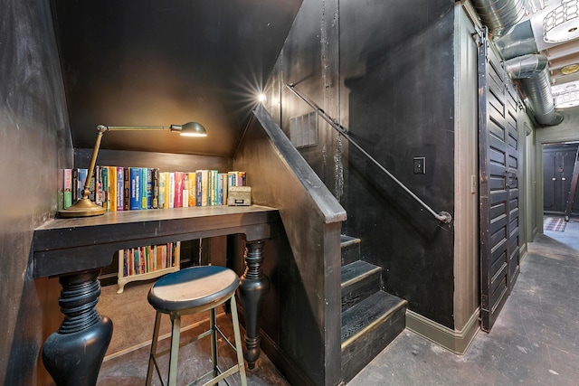 staircase with concrete floors