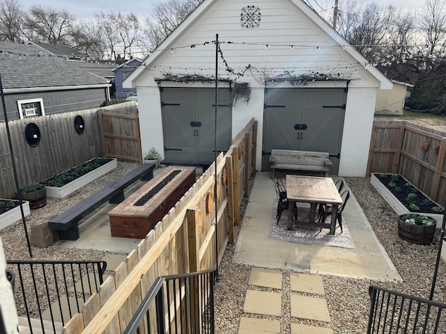 view of patio / terrace with a shed