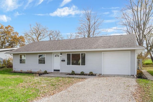 single story home featuring a garage and a front yard