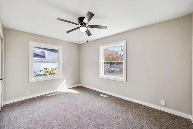 carpeted empty room featuring ceiling fan