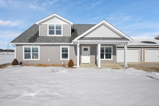 view of front of home with covered porch and a garage