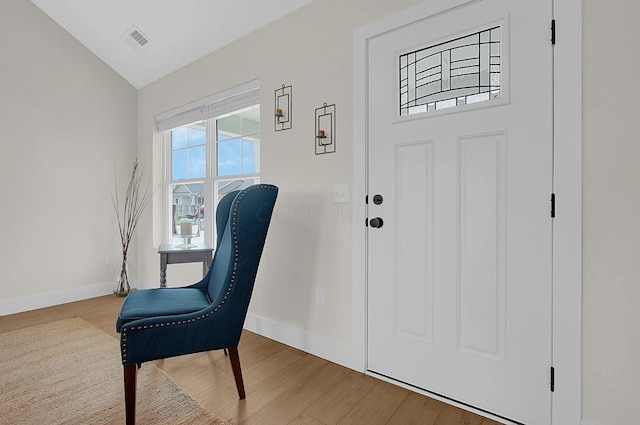 110 Cumberland Meadows Cir, Hebron, OH 43025 - foyer featuring baseboards, wood finished floors, and vaulted ceiling