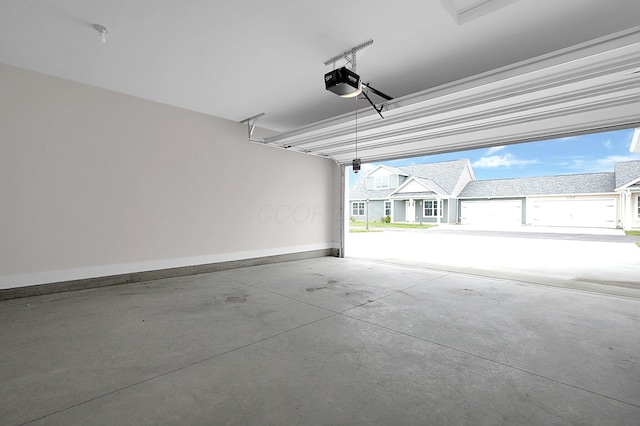 110 Cumberland Meadows Cir, Hebron, OH 43025 - garage featuring a garage door opener and baseboards