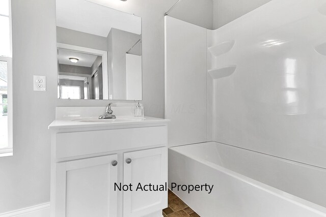 bathroom with vanity and bathing tub / shower combination