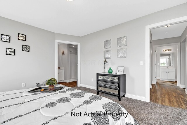 carpeted bedroom featuring ensuite bathroom